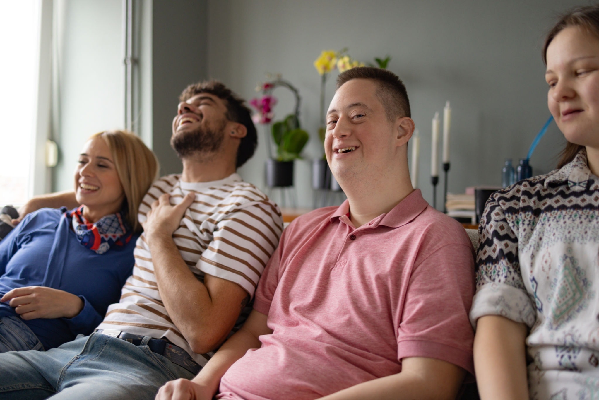 A caregiver providing attentive, compassionate support to an individual in a home setting